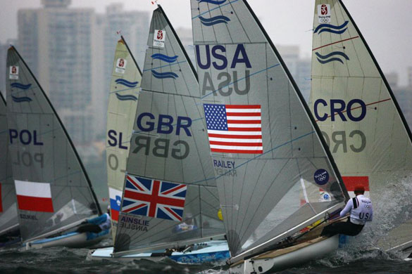 Ben Ainslie (C) of Great Britain and Zach Railey of the United States of America compete in the Finn class event
