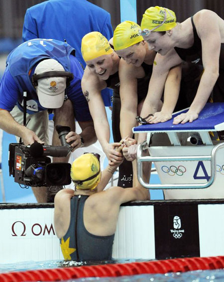 The Australian swimmers women's 4 X 100m medley relay team celebrates their win 