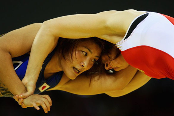 Gold medalist Kaori Icho of Japan (L) competes against Alena Kartashova of Russia the Women's Freestyle 63 kg Gold Medal Boult  