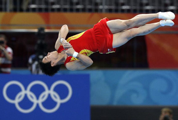China's Zou Kai performs during the apparatus finals