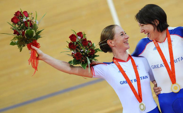 Gold medalist Rebecca Romero and Wendy Houvenaghel, who won silver,  celebrate on the podium after the women's individual pursuit final   