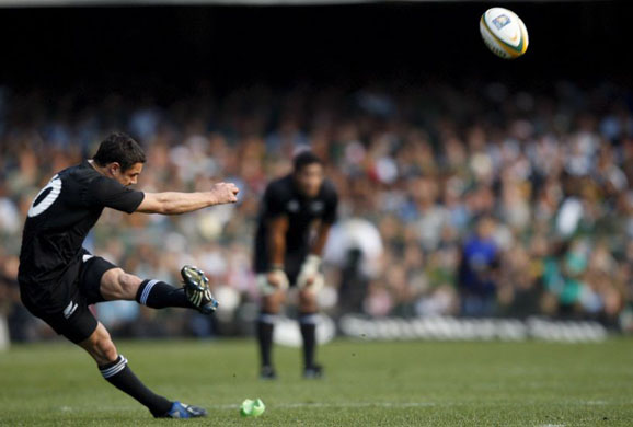 New Zealand's flyhalf, Daniel Carter, kicks at goals against South Africa