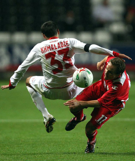David Vaughan (R) of Wales contests with Levan Khmaladze of Georgia during the International Friendly match