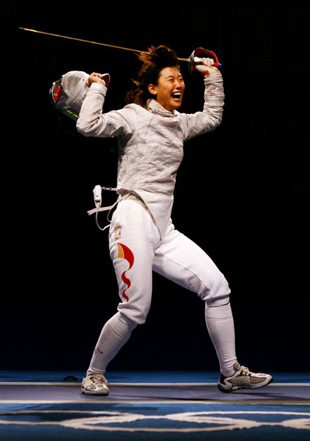 Tan Xue of China celebrates her victory over Sanne-Lise Touya of France