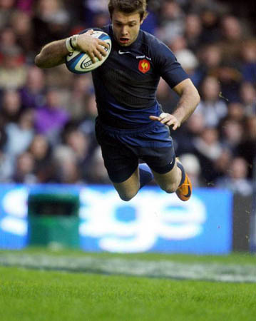 France's Vincent Clerc dives for the line with the ball to score during their Six Nations rugby union match at Murrayfield