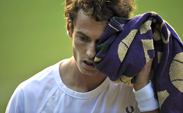 Andy Murray looks shell-shocked as he struggles to deal with Rafael Nadal's power