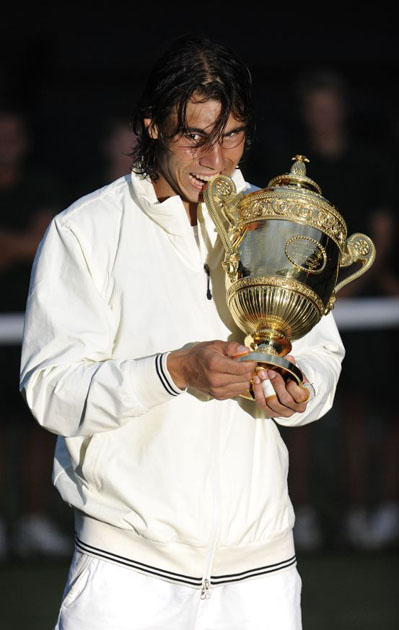 Nadal bites trophy