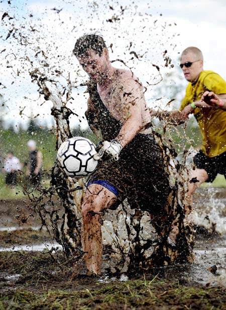 A swamp soccer player in action