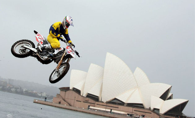 World Supercross champion, Australia's Chad Reed sails high above the Sydney Opera House to promote the launch of the Australasian Super X Championship