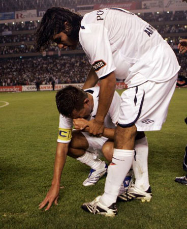 Ecuador's Liga Deportiva Universitaria's players react as they celebrate at the end of a Copa Libertadores semifinal soccer game against Mexico's America