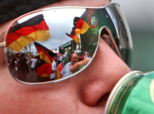 German fans are reflected in a supporter's shades in Klagenfurt 