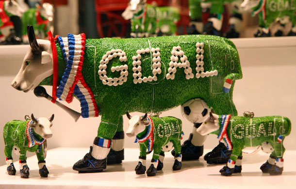 A football pitch decorated cow is pictured in the shop window of a store in Bern 
