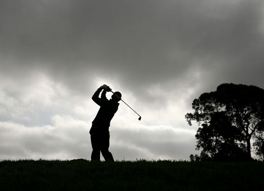 Adam Scott of Australia watches his shot  in San Diego