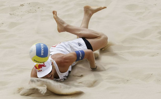 Julius Brink of Germany dives for the ball during a match against Estonia in Berlin 