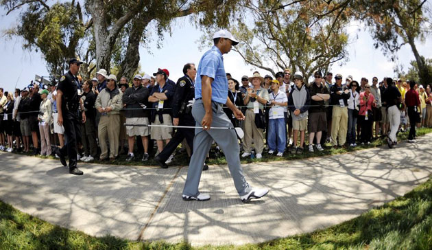Tiger Woods of the US walks between the 14th and 15th at US Open 
