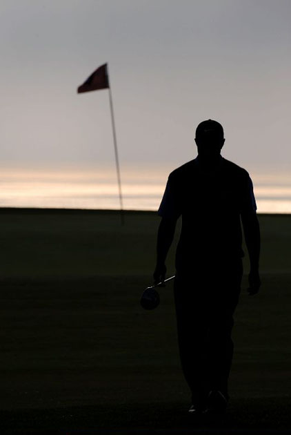 Tiger Woods walks off the 14th hole at US Open 