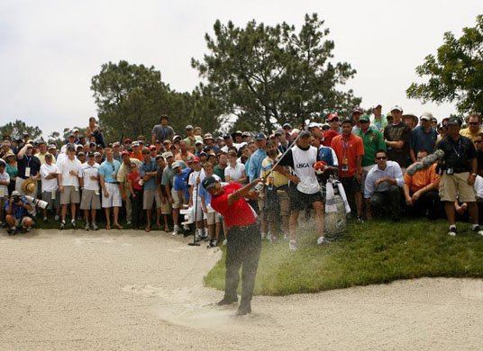  Tiger Woods plays out of the bunker at the 15th hole of the US Open 
