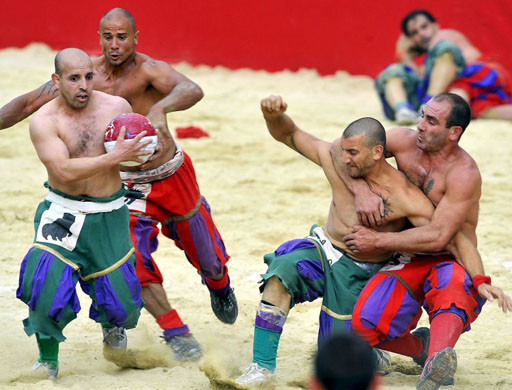 layers take part in a game of the Calcio Storico Fiorentino or traditional soccer played in costume in Florence 