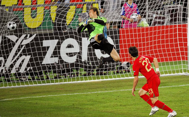 Portuguese forward Helder Postiga (R) scores his team's second goal in Basel 