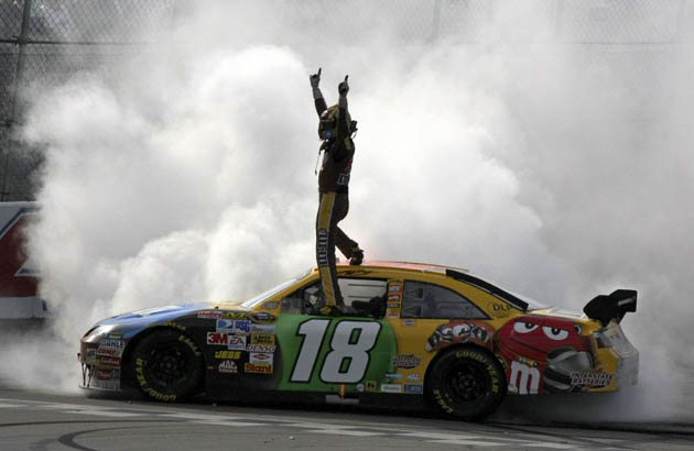 NASCAR driver Kyle Busch celebrates after winning the Aaron's 499 auto race at Talladega Superspeedway