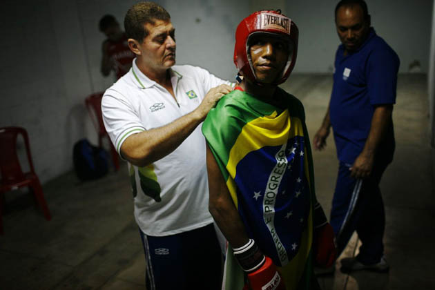 A Brazilian flag is draped over Robson Coinceicao