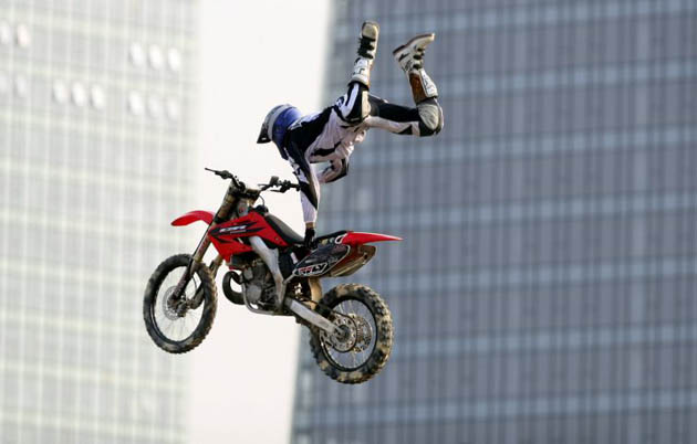Justin Homan of the U.S., flies through the air during Freestyle Motocross Competition during the X Games