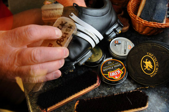 Scrubbing a pair of golf shoes