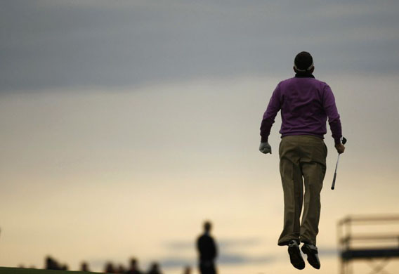 Anthony Wall jumps after playing a shot on the 11th hole during the third round at the Volvo Masters golf tournament    
