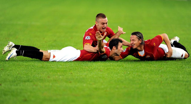 AS Roma's Mirko Vucinic, Philippe Mexes and Daniele De Rossi celebrate after Vucinic scored against Chelsea during their Champions League match   