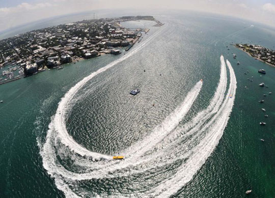 Offshore racing powerboats make the turn during the first of three race days at the Key West World Championship