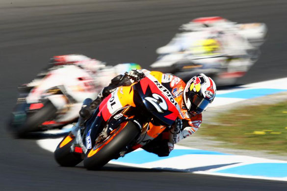 Dani  Pedrosa turns out of a corner during  warm up for the Australian MotoGP