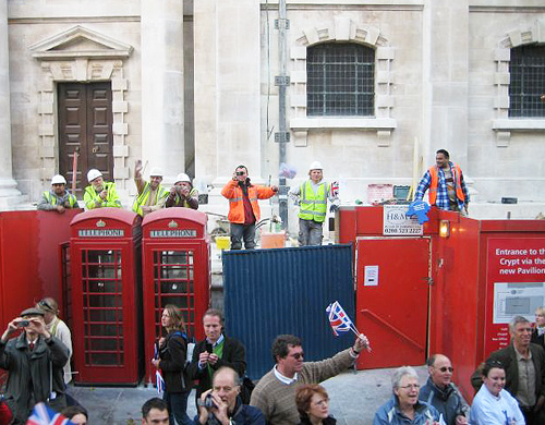 Workmen cheer the parade