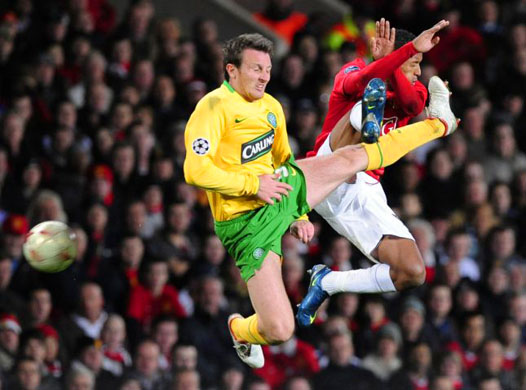 Scott Brown and Nani jump for the ball