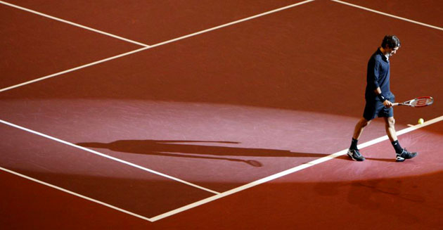 Roger Federer enters the court