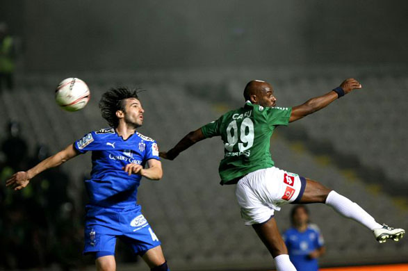 footballers leap for a header