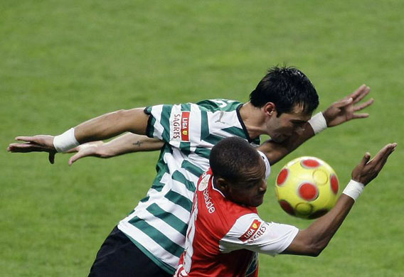September 1 2008: Braga's Albert Meyong Ze jumps for the ball with Sporting's Tonel Nogueira during their Portuguese Premier League match in Braga