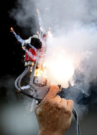 September 2 2008: A referee fires a starting gun at the IAAF Super Grand Prix athletics meeting in Lausanne