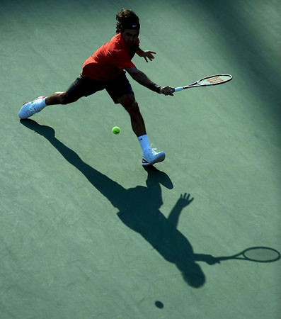 September 4 2008: Roger Federer runs down a backhand return to Gilles Muller during their quarter finals round match on the eleventh day of the US Open tennis tournament