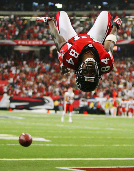 Roddy White of the Atlanta Falcons does a back-flip to celebrate his touchdown against the Kansas City Chiefs 