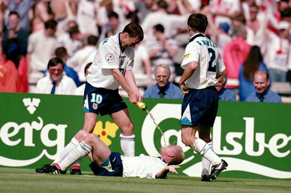 Paul Gascoigne and Teddy Sheringhan re-create the infamous 'dentist chair' incident after Gascoignes goal aggainst Scotland in Euro 96