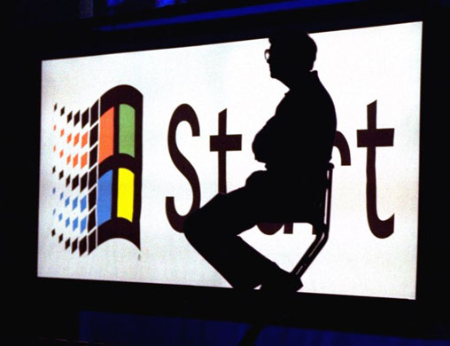 Bill Gates sits on stage during the Windows 95 Launch Event 