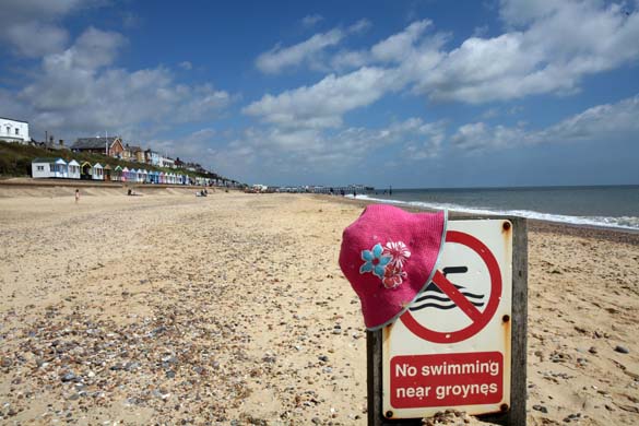 Hat and no swimming sign