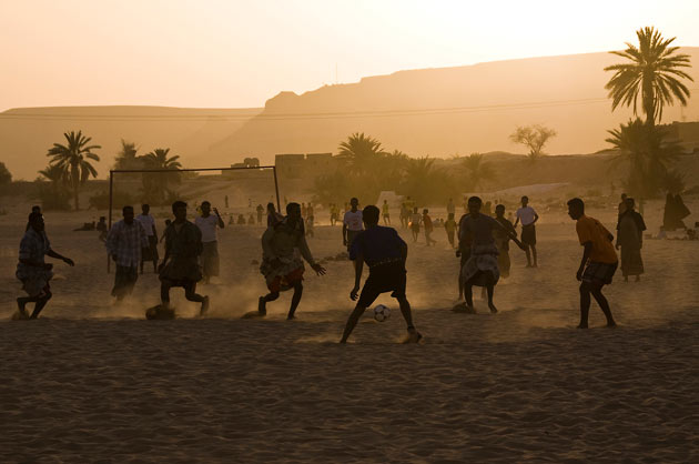 Footballers in Shibam in Wadi Hadramawt, Yemen