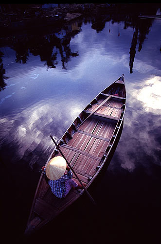 Woman on boat in Vietnam