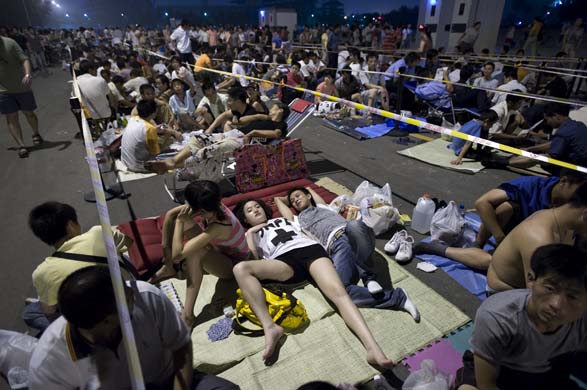 People rest in the queue for olympic tickets