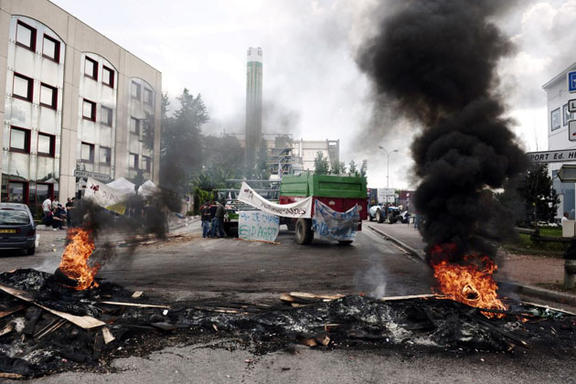 A blockade set up by French farmers is seen at the entry of the Edouard Heriot port, France's biggest fluvial harbor as they protest over soaring fuel prices