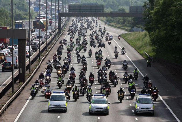 Bikers travel along the M60 at a go slow protest against fuel prices near Manchester