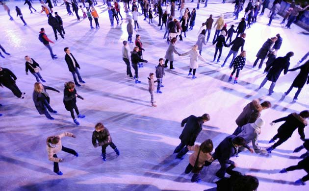 Skaters make the most of the cold snap by enjoying the seasonal ice rink outside the Natural History Museum on Saturday evening