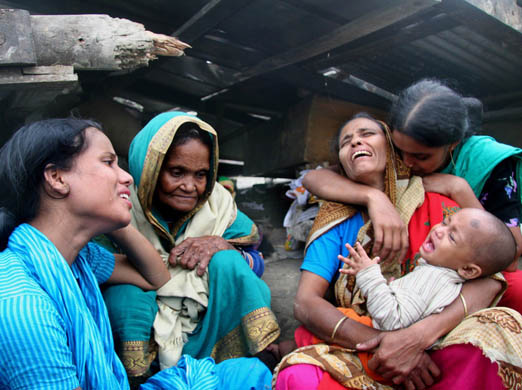 Families grieve amid the ruins of their community