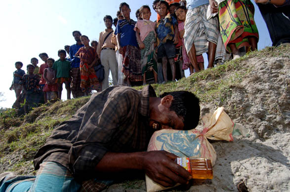 A man mourns the loss of a loved one